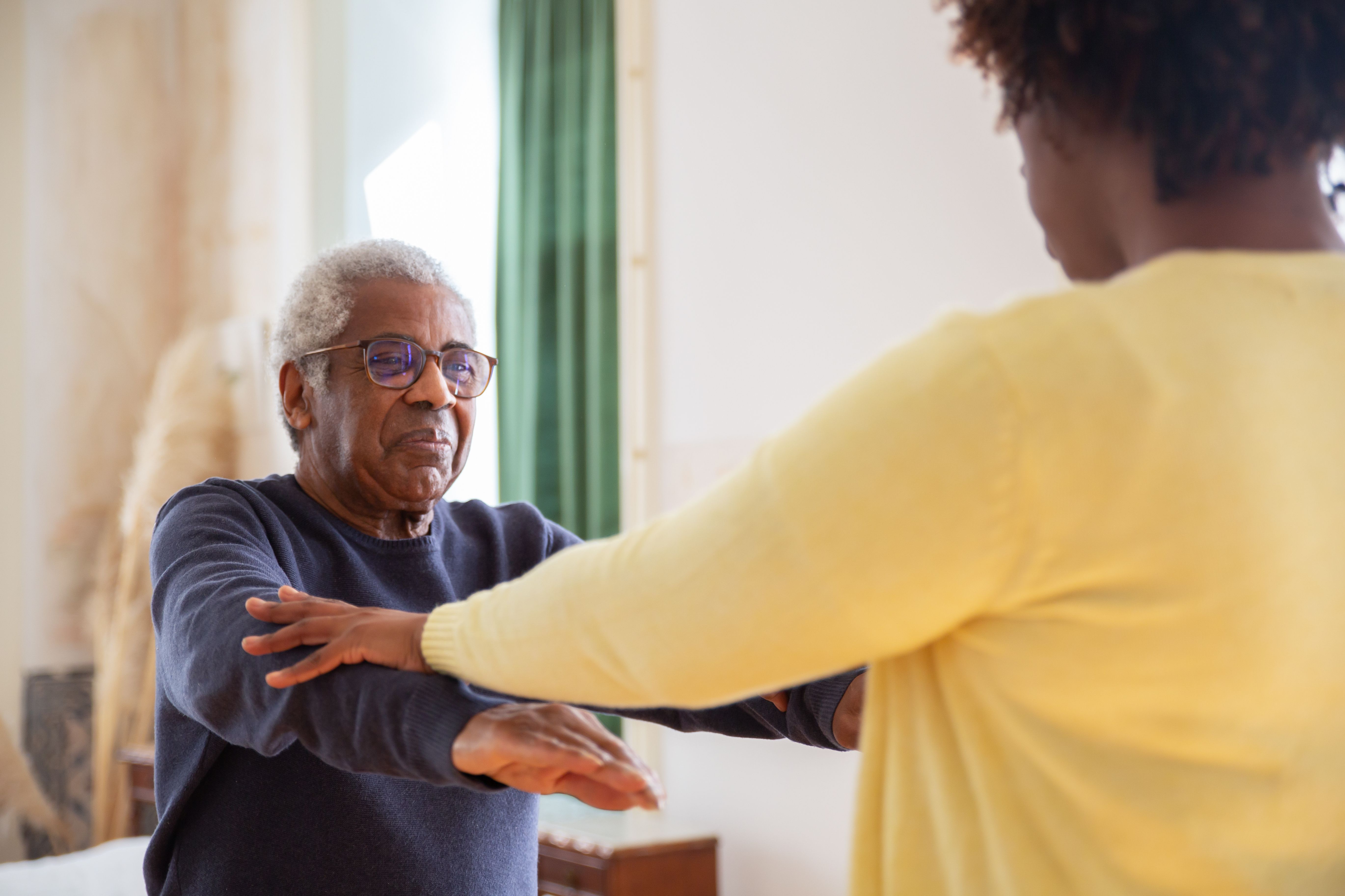 Caregiver supporting a patient at home